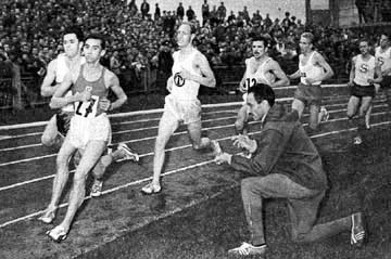 Alain Mimoun, Olympic Marathon Champion, controlling  Barris' time, winner of the 1,500 metres in Leverkusen